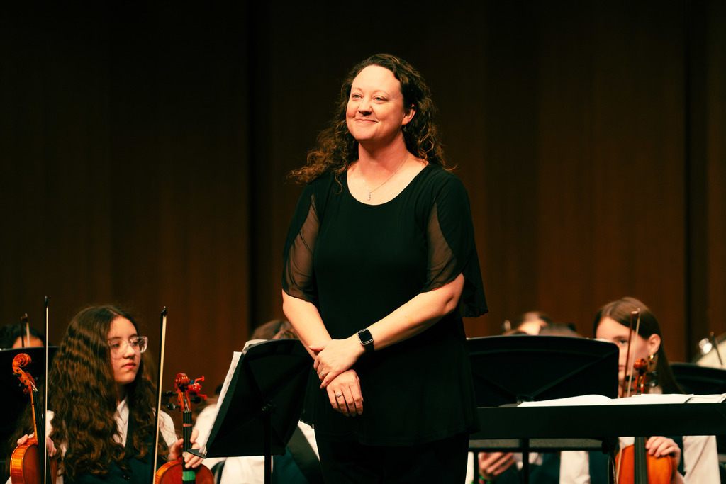 Orchestra director smiling