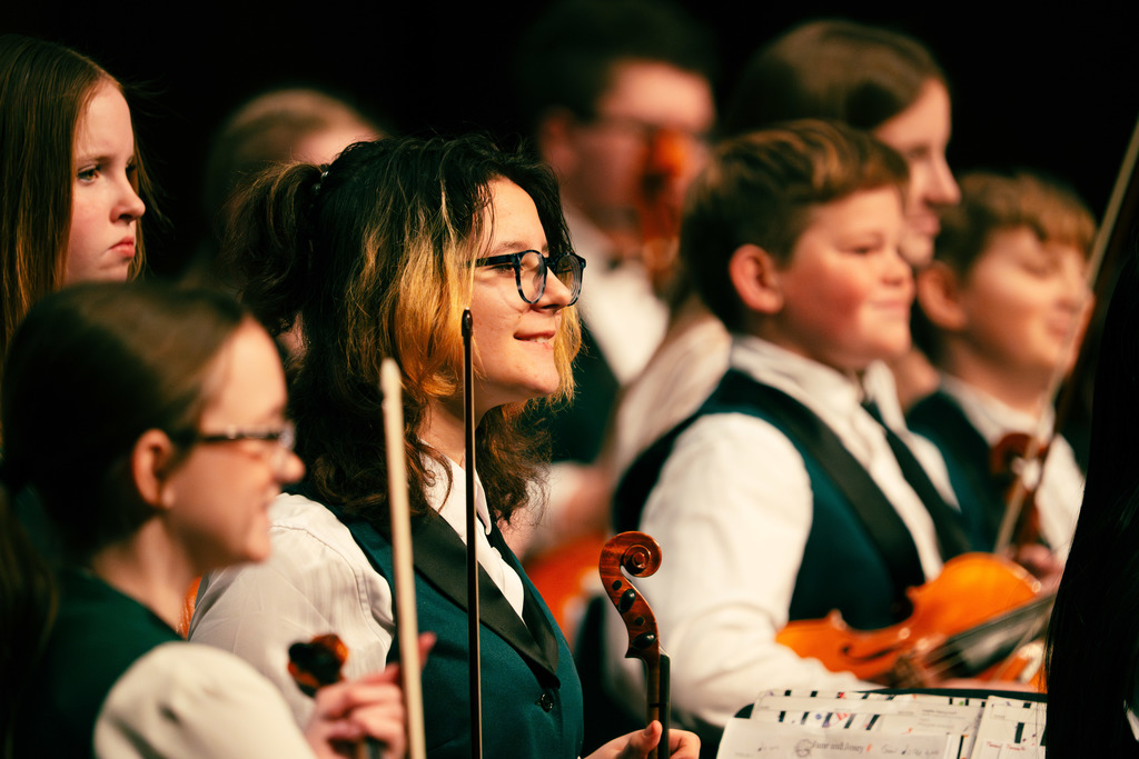 Orchestra students smiling