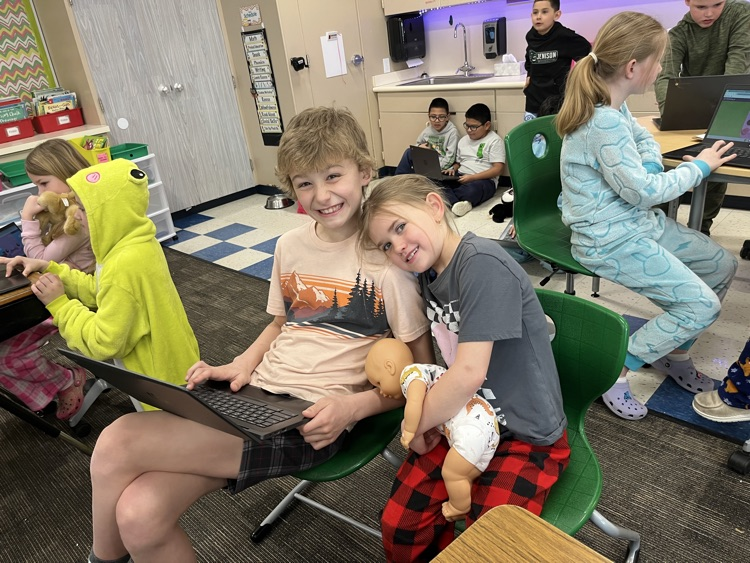 two students smiling 