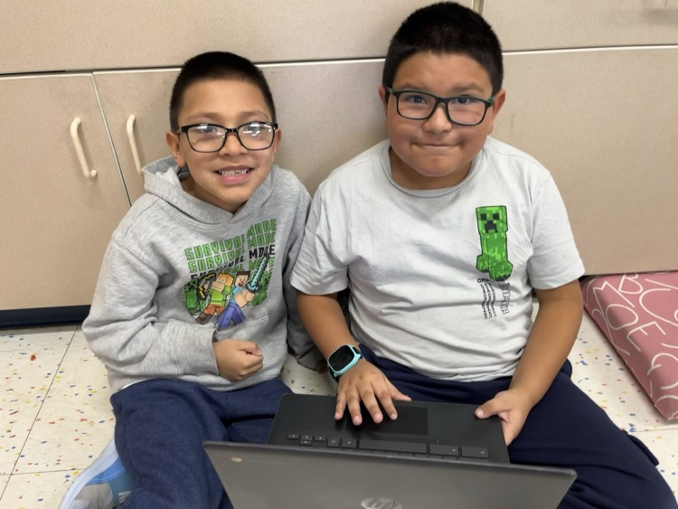 two students smiling 
