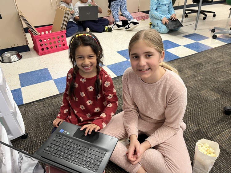 two students smiling 
