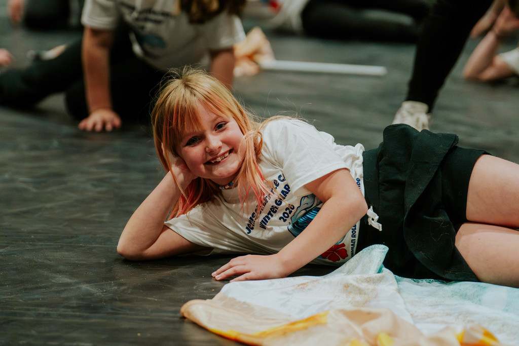 Elementary students smiling after performance