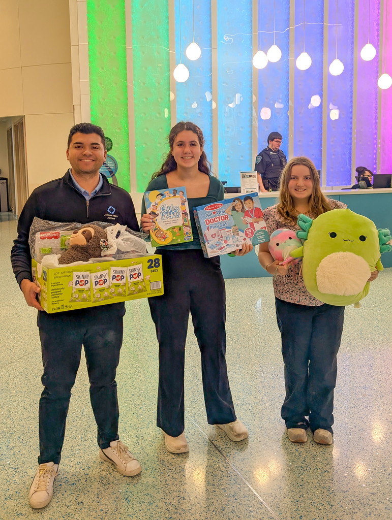 Students and staff dropping off donated toys to hospital