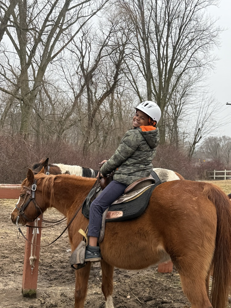 Student riding a horse