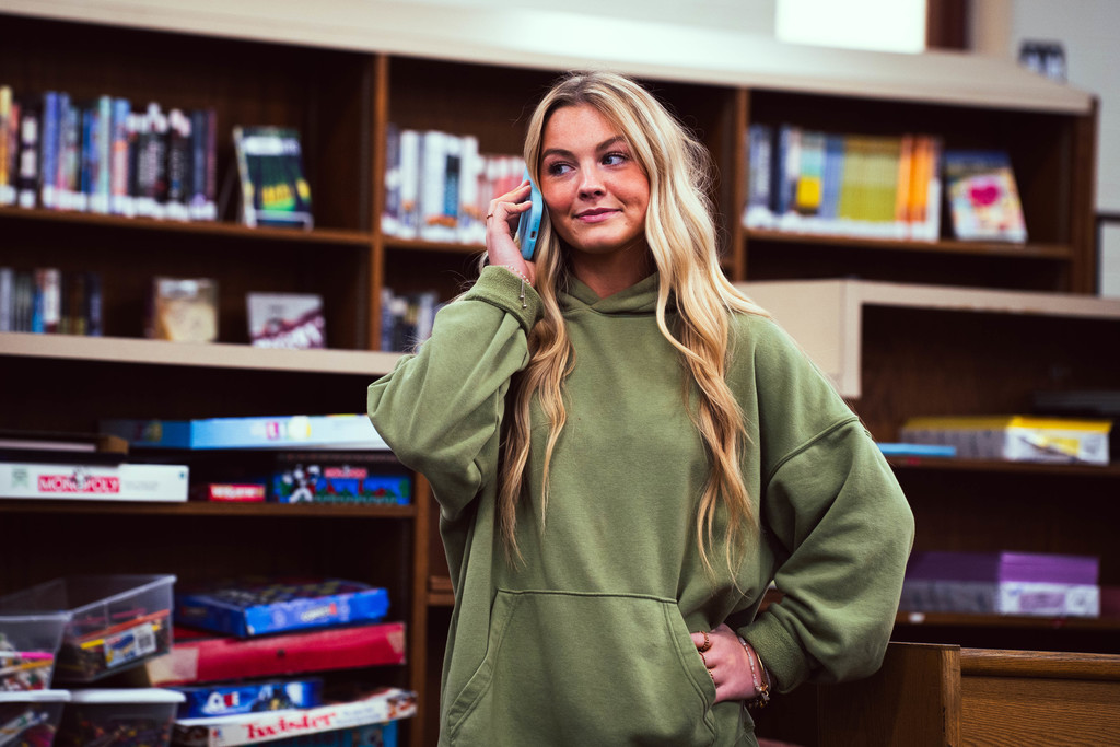 Peer educator student on phone