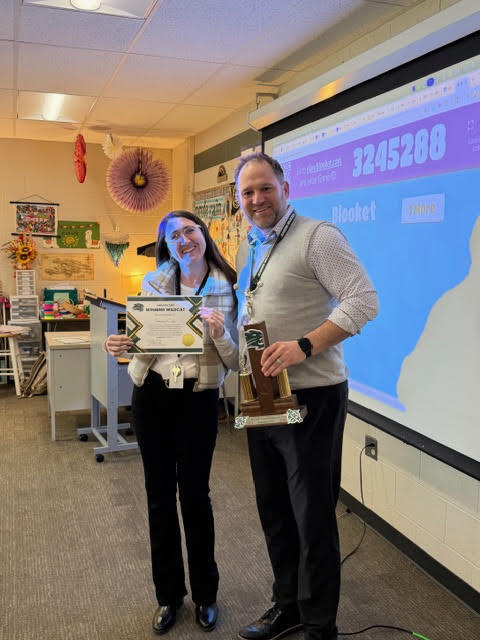 Teacher celebrating award