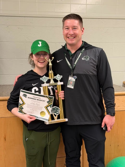 Trainer celebrating award