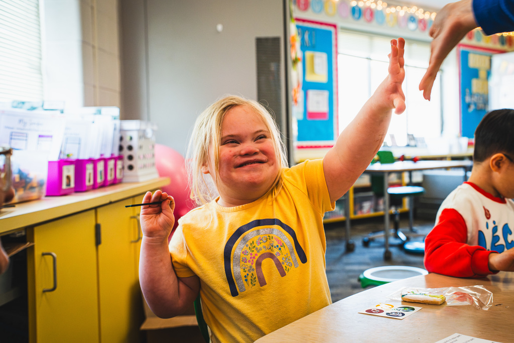 Student smiling in classroom