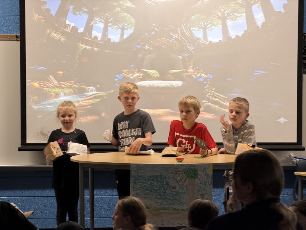 Four students present "Reader's Theater" presentations in Mrs. DeJonge's classroom.