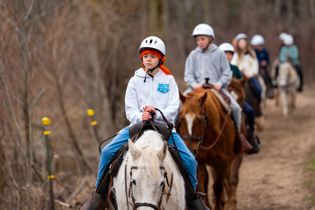 Students riding horses