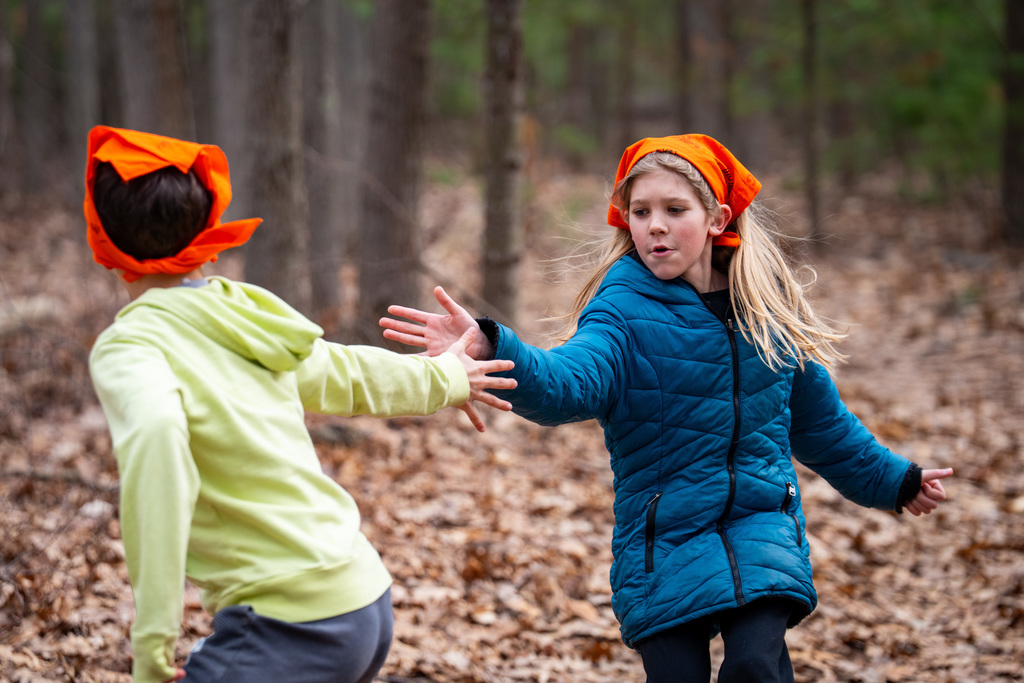 Student running in obstacle course