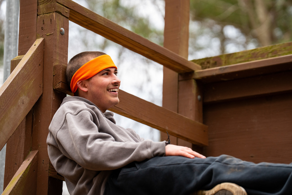Student smiling on obstacle course