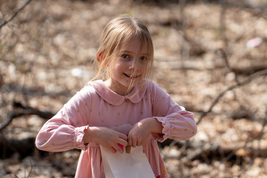 Student smiling during egg hunt