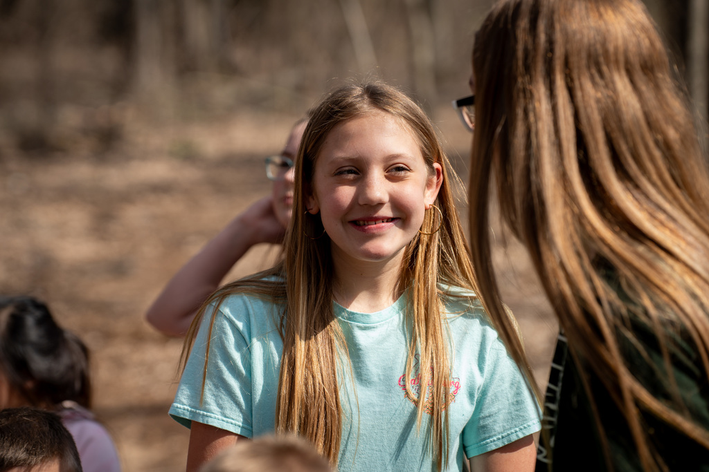 Student smiling during egg hunt