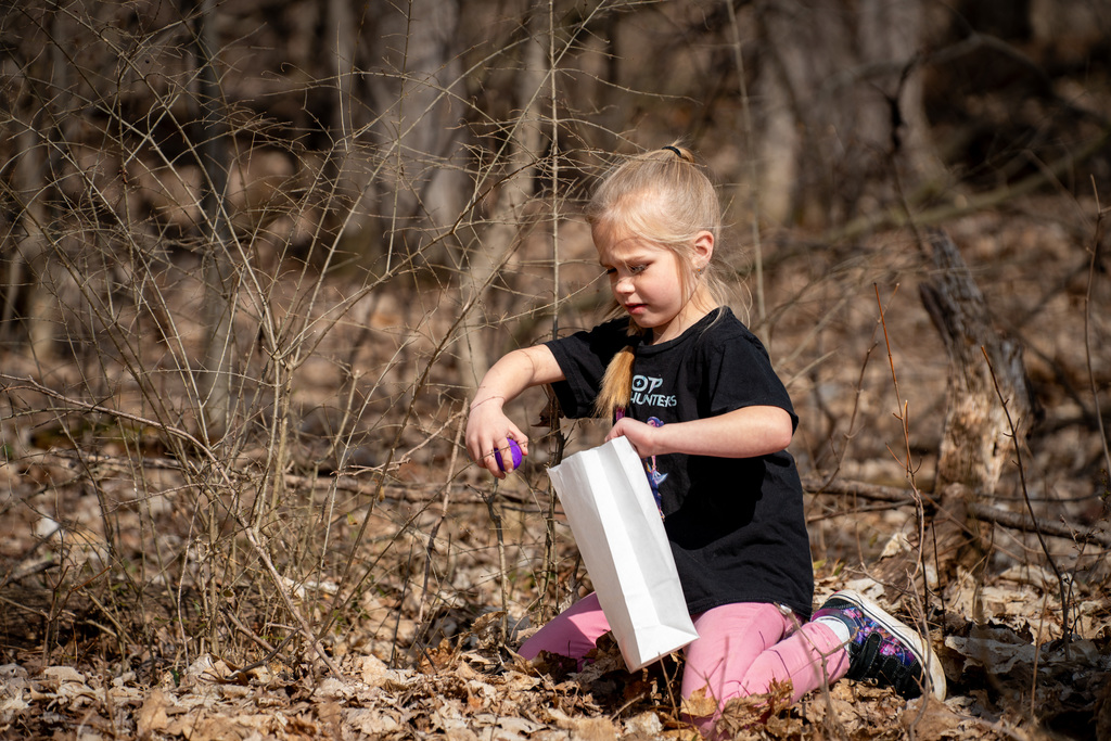 Student reaching for egg