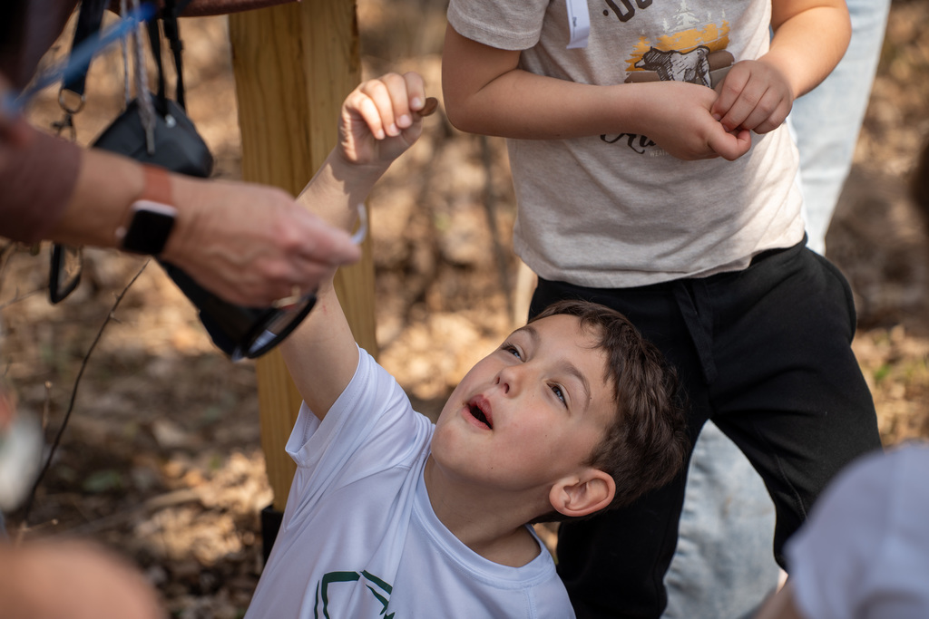 Student smiling during egg hunt