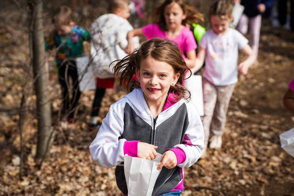 Student smiling during egg hunt