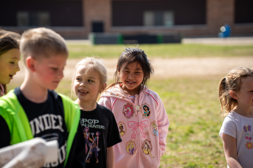 Student smiling during egg hunt