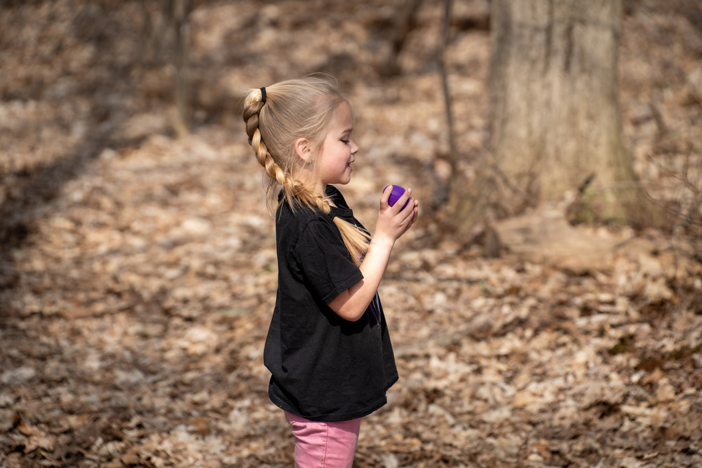 Student smiling during egg hunt