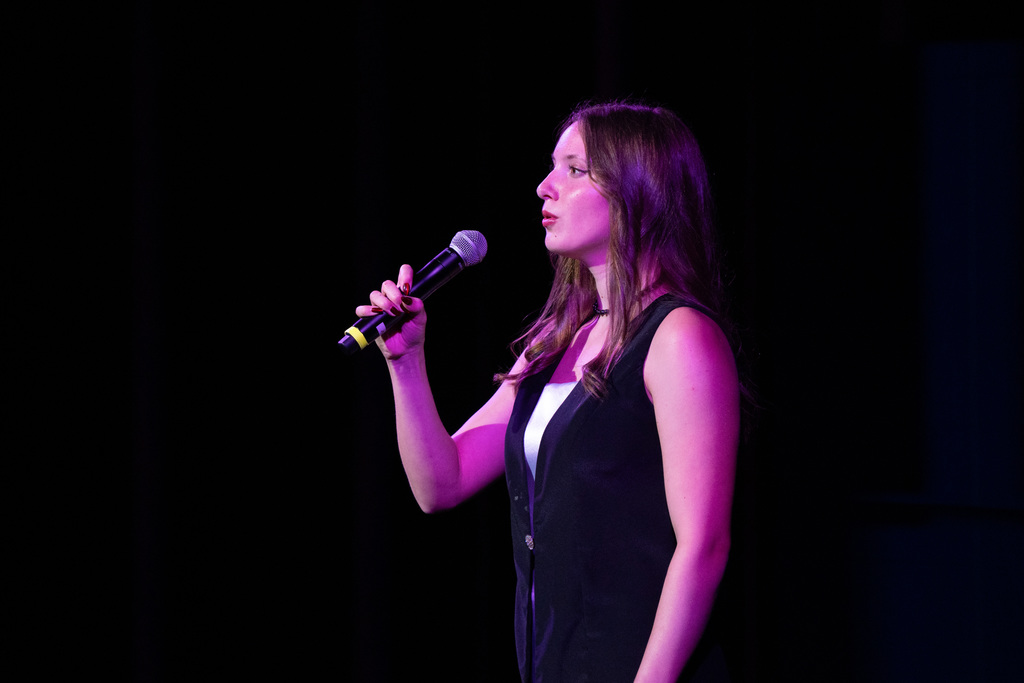 Female choir member singing solo