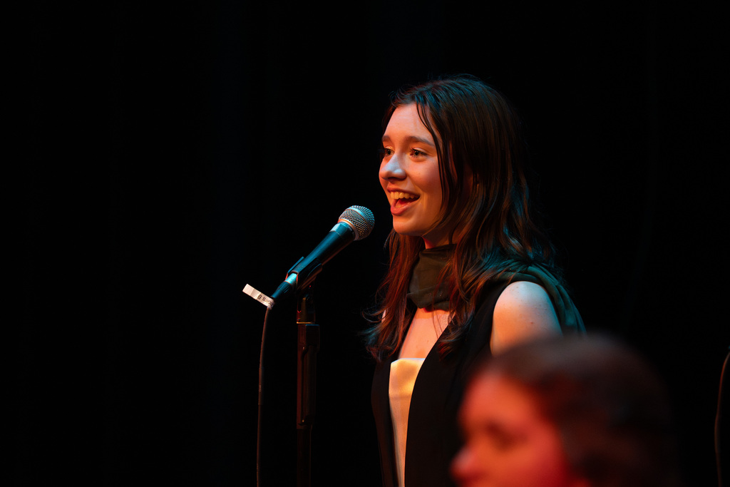 Female choir member smiling
