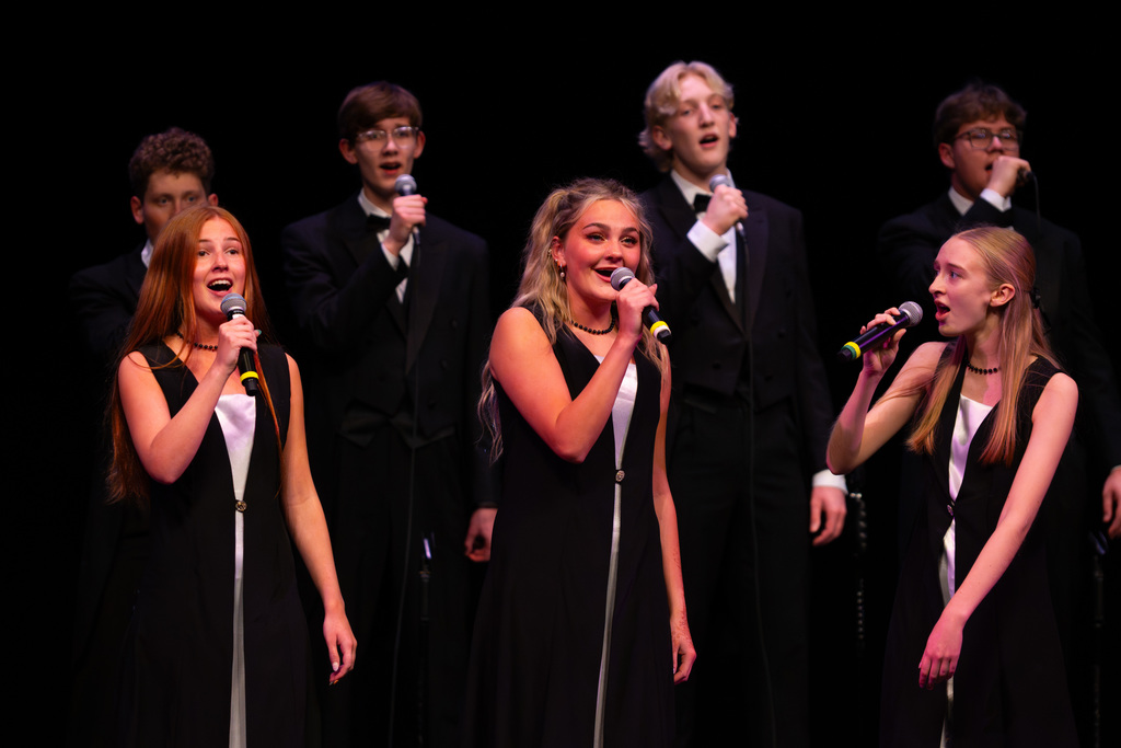Choir members singing as a group