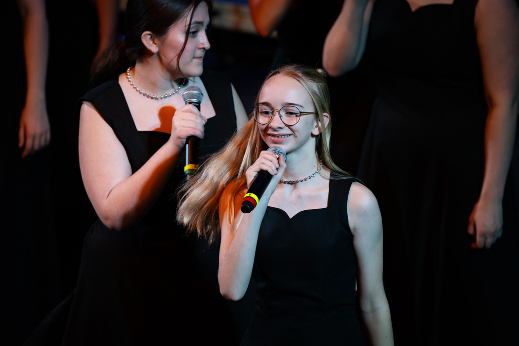 Female choir member smiling