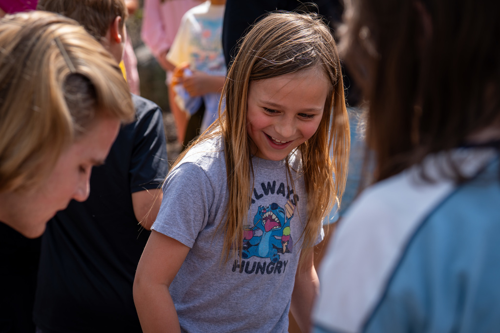 Elementary student smiling near river