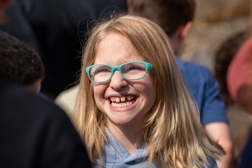 Elementary student smiling near river