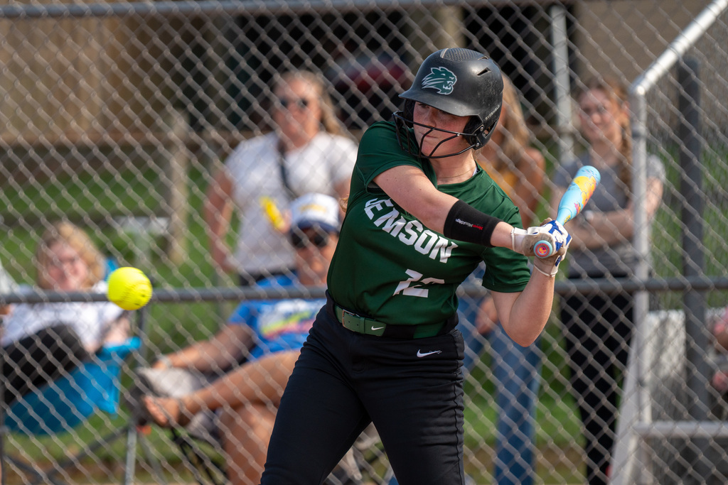 Softball player swinging the bat