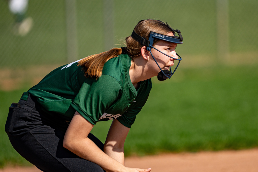 Softball shortstop preparing for play