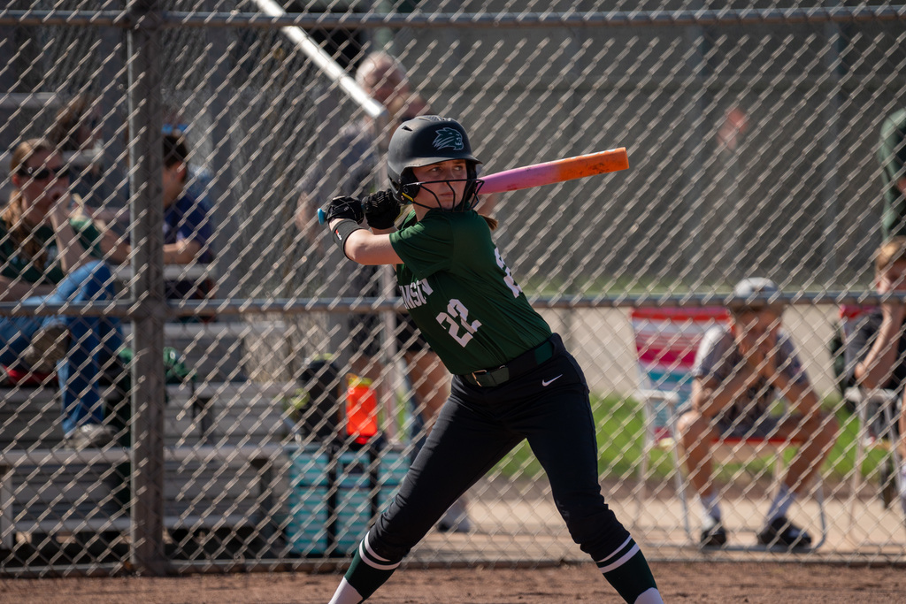 Softball player batting