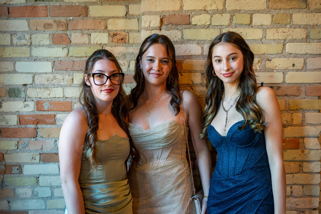 Students posing on red carpet at prom