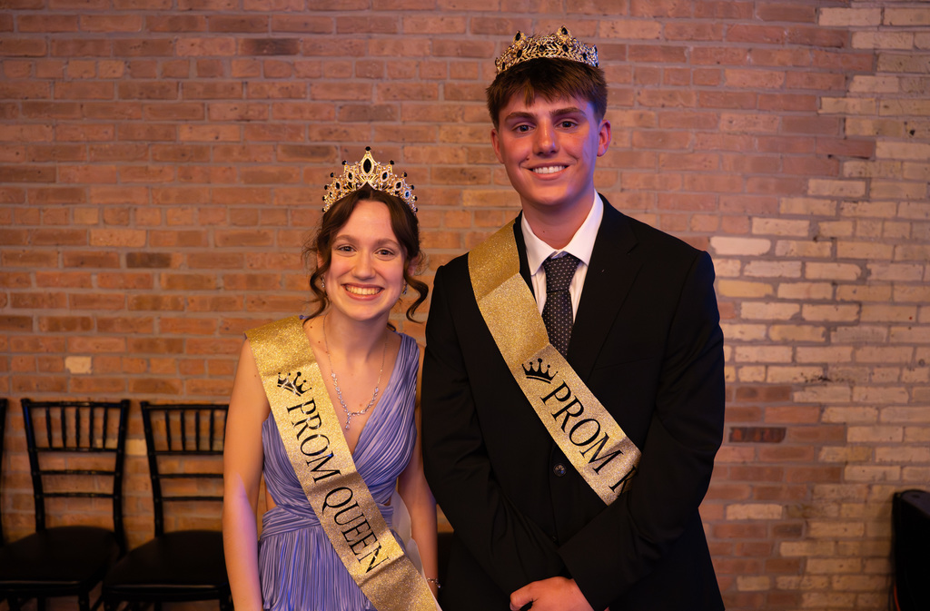 Prom king and queen posing