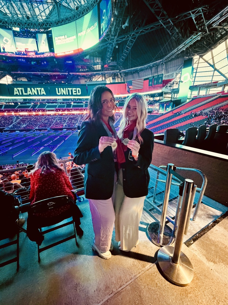 DECA students with medal in Atlanta