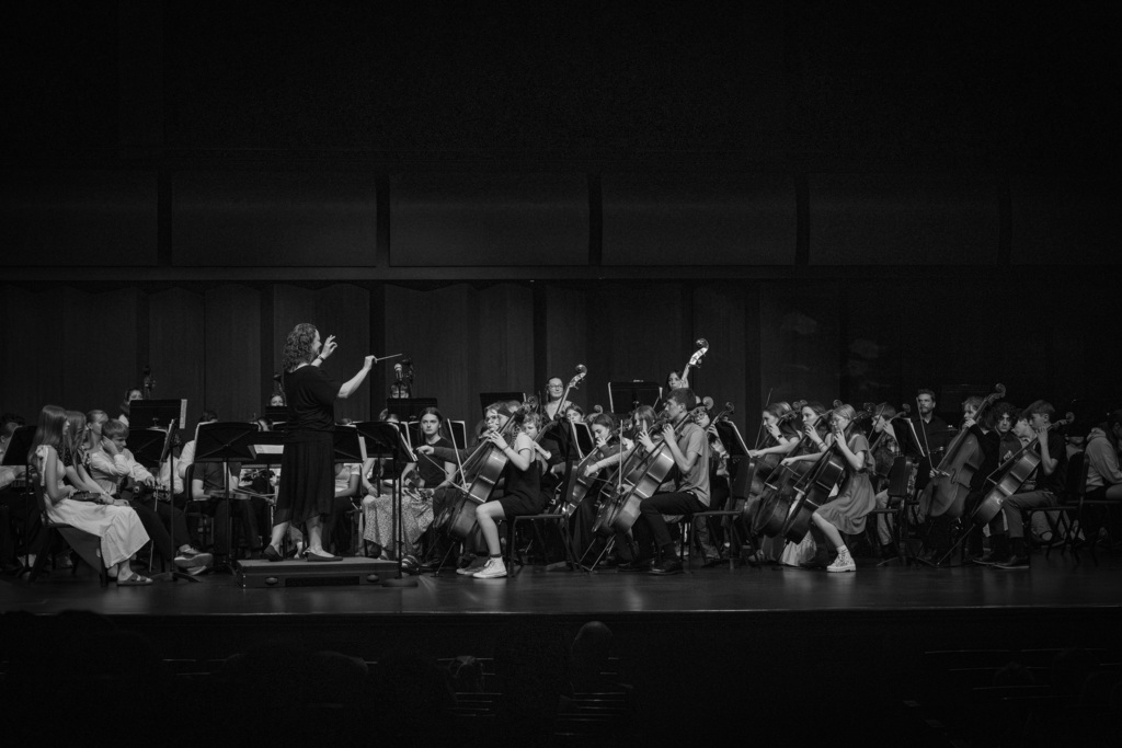 Orchestra students playing on stage