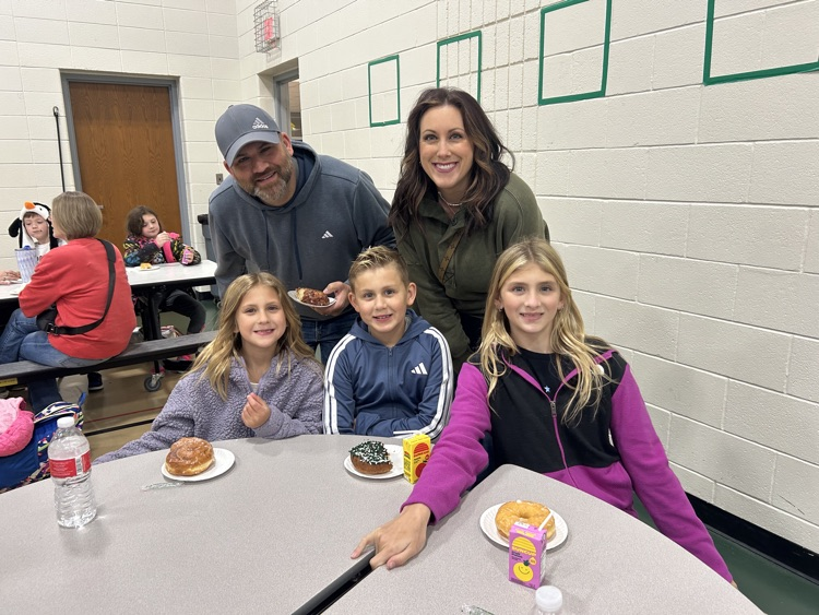 families enjoying the Donuts with a Grown Up Event