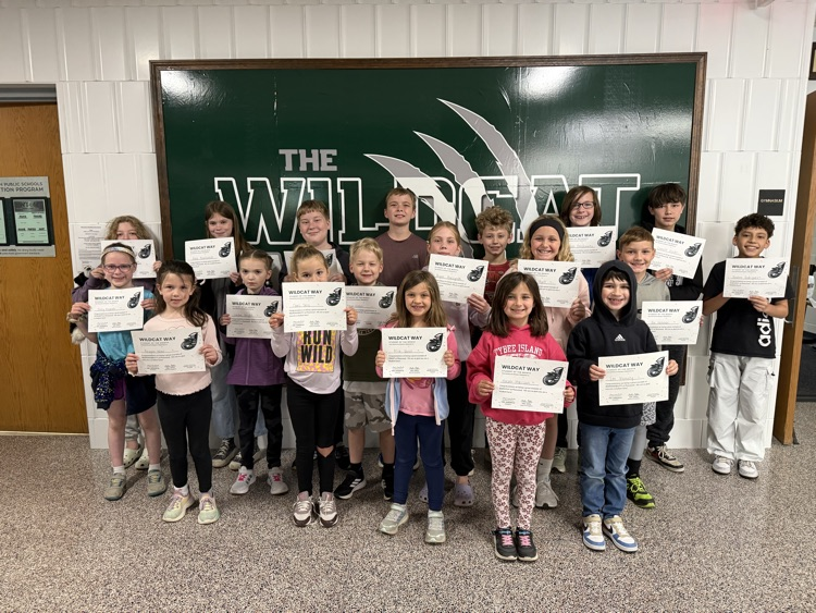 students smiling with certificates