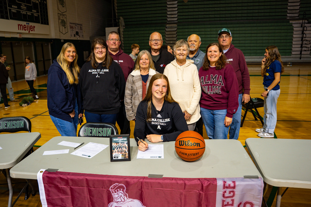 Student with family behind her