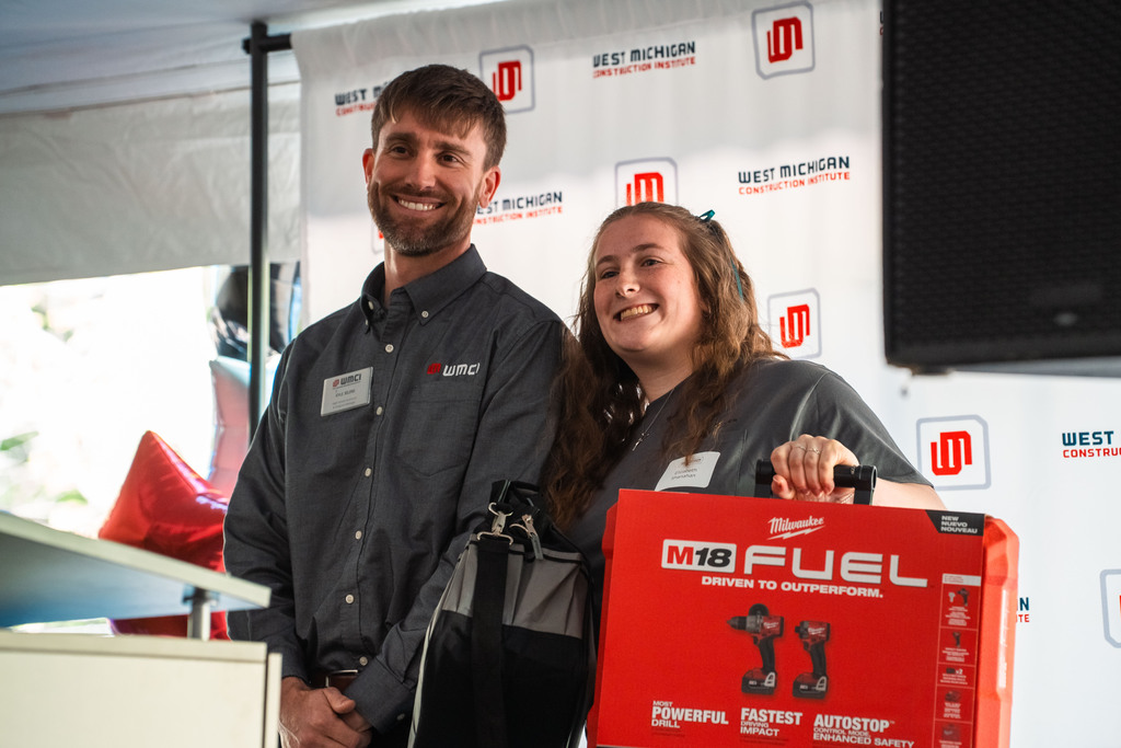 Construction student posing with award