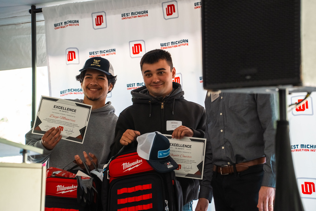 Construction student posing with award