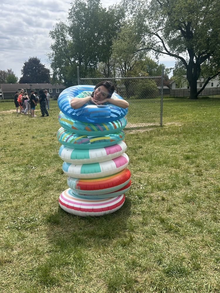 Teacher in pile of inner tubes