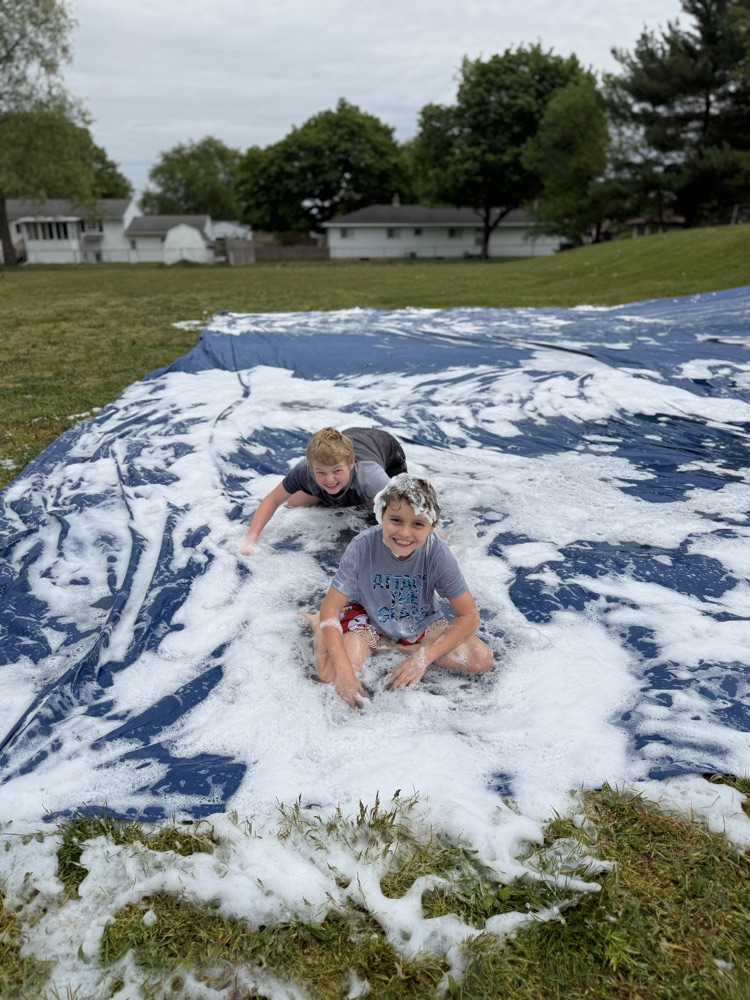 student on slip n slide