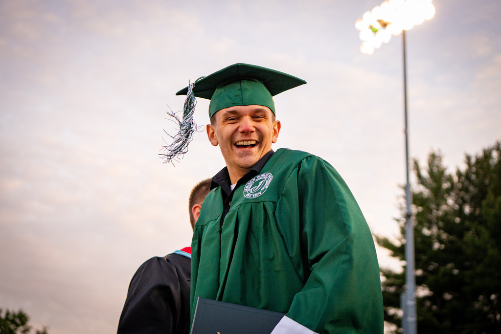 Graduate laughing