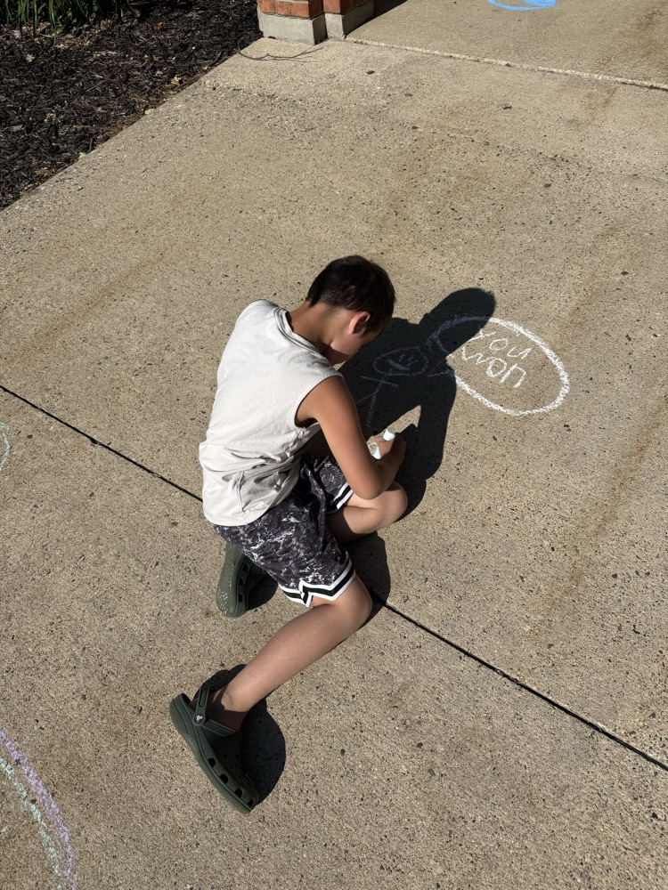students drawing with chalk