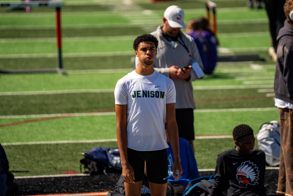 Jenison high jumper stretching