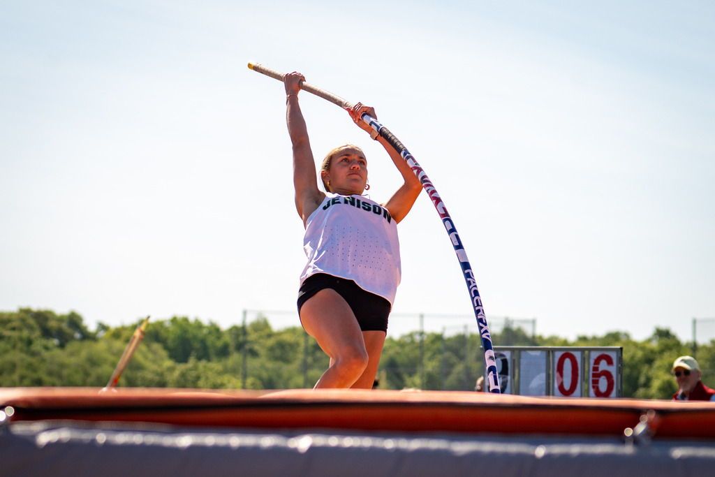 Jenison girls pole vaulter flying through air