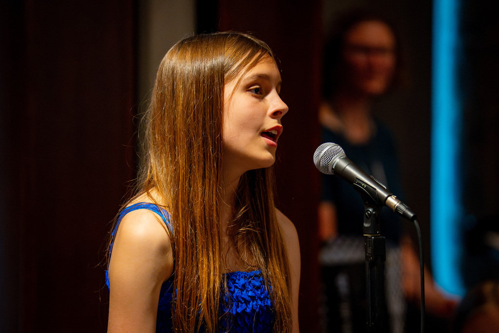 Girls choir member singing
