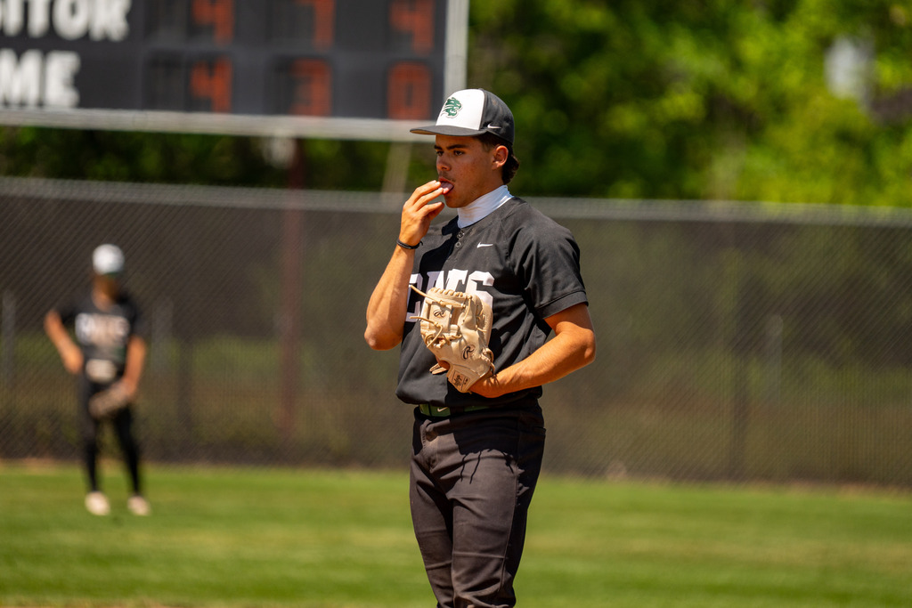 Pitcher licking finger