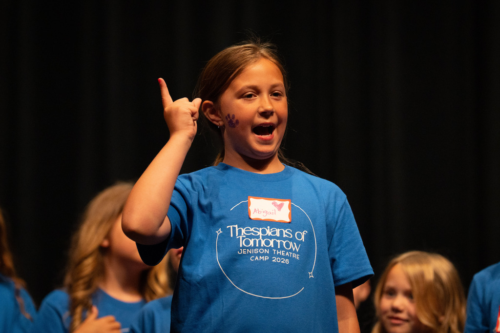 Student at theater camp singing
